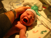 Daddy touching his son for the first time