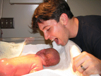 Daddy wanting to bite his adorable baby boy