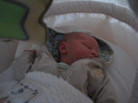 Snoozing away in his pooh jacket