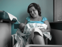 Momma holding the new love in her life